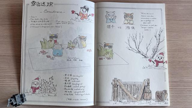 Opened notebook showing a double page filled with drawings and notes, including a list of Chinese vocabulary. Drawings include cats hiding behind fake grass, snowmen, a fence and a tree. 
