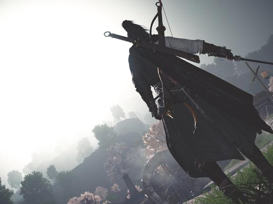 Game picture of a character dressed with a wuxia warrior outfit, turning his back to the camera and holding a sword. The background shows a beautiful scenery of trees and cliffs in the fog. 